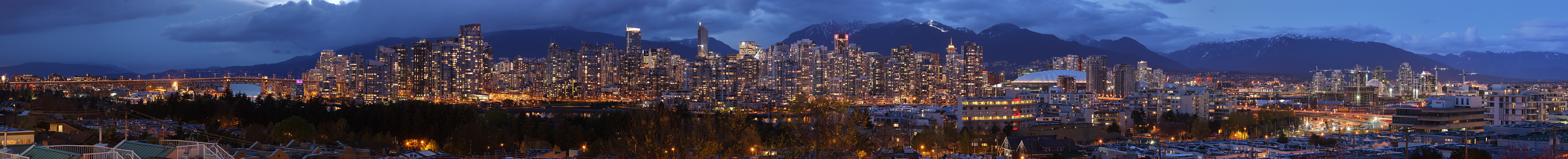 Vancouver, BC, viewed from the south with mountains in the background. Blended exposure version. 20 stitched images (original at 50,000 x 4,000 px).